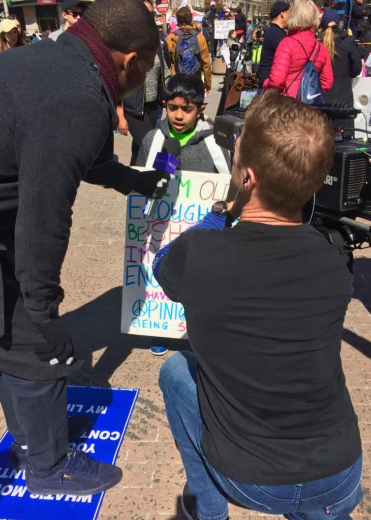 Being interviewed at the march